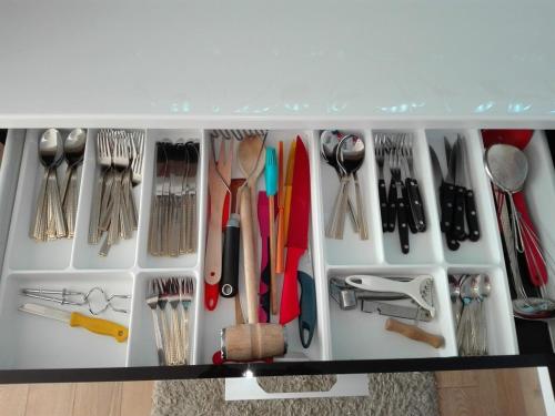 a drawer filled with lots of kitchen utensils at Apartment Zama in Štrbské Pleso
