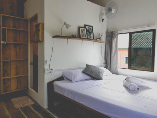 מיטה או מיטות בחדר ב-DAHLIA Guesthouse
