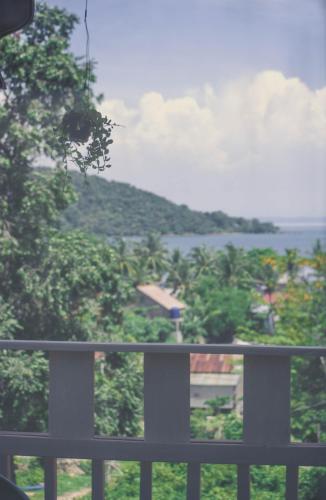 a view of the ocean from a balcony at DAHLIA Guesthouse in Koh Rong Sanloem