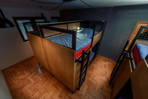 a couple of bunk beds in a room at Town hostel in Peje