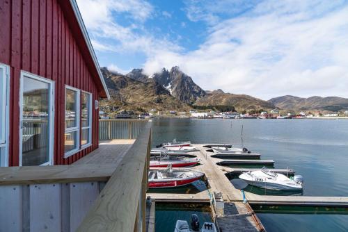 a group of boats docked at a marina at Hemmingodden Lodge in Ballstad
