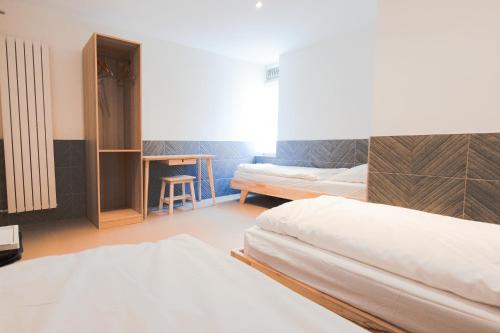 Ένα ή περισσότερα κρεβάτια σε δωμάτιο στο Hotel The Globe