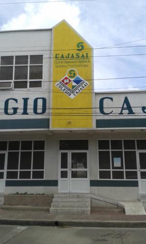 a building with a cgi car sign on it at Posada J&J Forbes - 1 in San Andrés