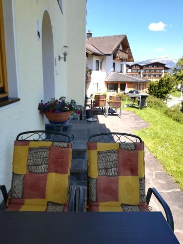 a table and chairs sitting on a patio at Ferienwohnung 2 Haus Dörfler in Abtenau