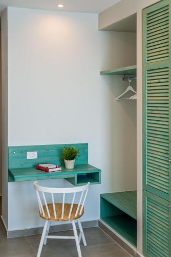 a desk and a chair in a room at Samaria by the Sea in Khóra Sfakíon