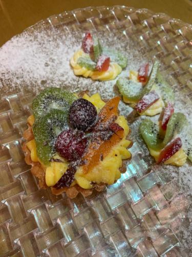 a plate of food with fruit on it at Hotel Gabbiano in San Domino