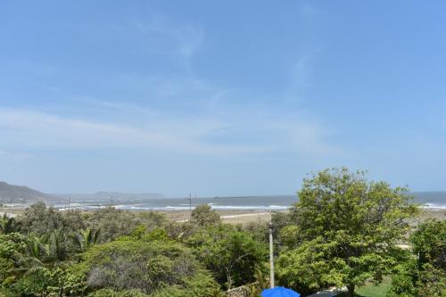 a view of the beach from the house at Porto Bello Hotel Boutique in Puerto Colombia