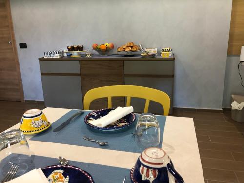 a table with plates of food on top at B&B Artemide in Agropoli