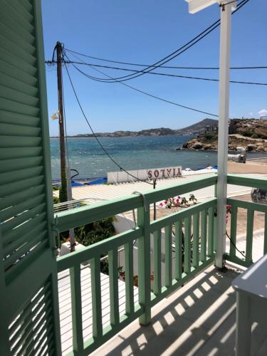 a view of the beach from the balcony of a house at Sigma Studios on The Beach in Naxos Chora