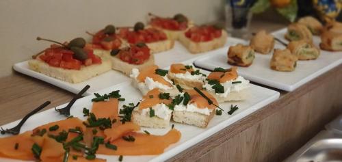 a table with three plates of food on it at Ines bed and breakfast in Giardini Naxos