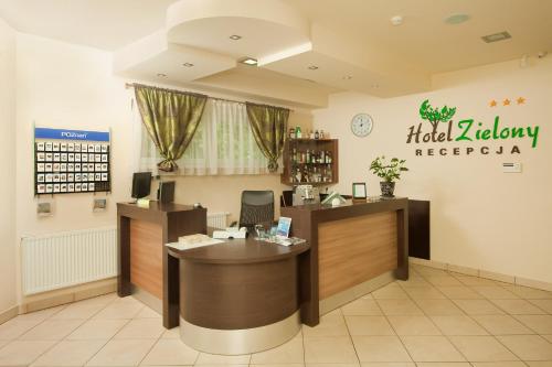a waiting room at a hospital with a reception desk at Hotel Zielony in Poznań