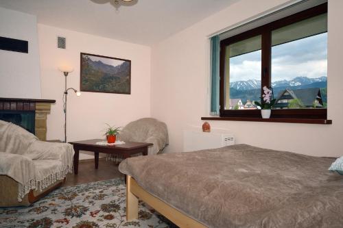 Posteľ alebo postele v izbe v ubytovaní Apartament Kosista