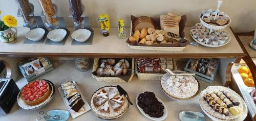 a shelf filled with lots of different types of food at Ines bed and breakfast in Giardini Naxos