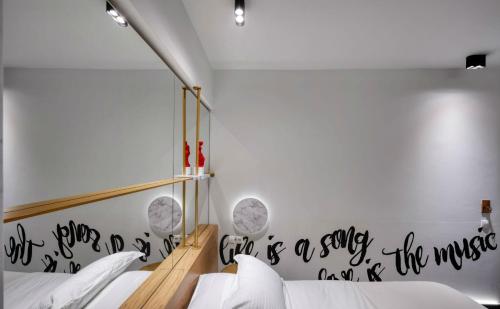 Postel nebo postele na pokoji v ubytování Thomais Boutique Hotel