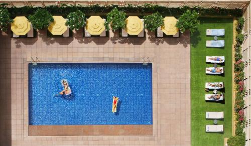 an overhead view of a swimming pool in a hotel at President - IHCL SeleQtions in Mumbai