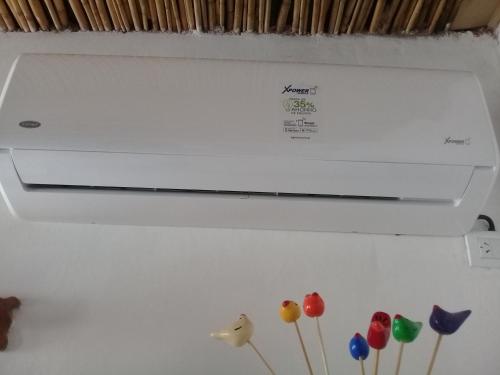 a white refrigerator with some balloons on it at Cabaña El Cardón,casita en el campo quebradeño in Humahuaca
