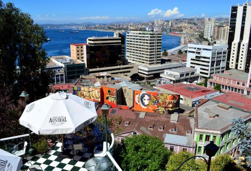a view of a city with an umbrella at Hotel Brighton in Valparaíso