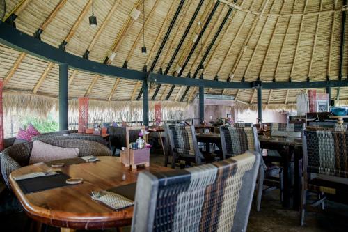a room filled with lots of tables and chairs at Seavana Koh Mak Beach Resort in Ko Mak