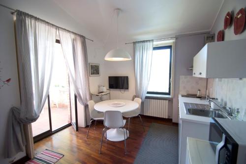 a kitchen with a table and chairs and a sink at Villa Vittoria in Citta' Sant'Angelo