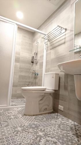 a bathroom with a toilet and a sink at NO.14 in Tainan