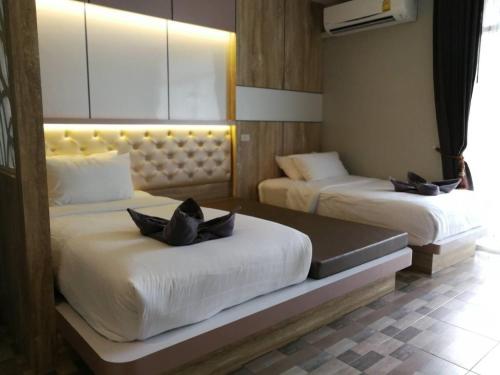 Ein Bett oder Betten in einem Zimmer der Unterkunft Ricci House Resort