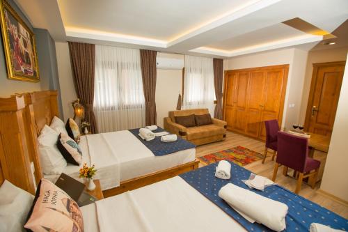 Postel nebo postele na pokoji v ubytování The PeraPort Hotel
