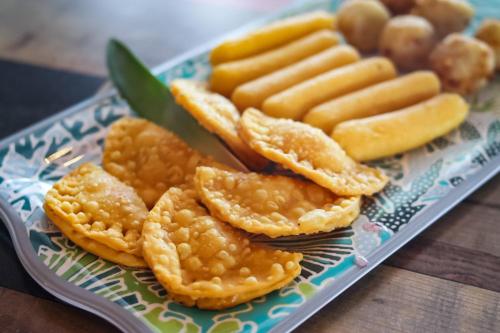a plate of crackers and snacks on a table at La Jamaca - An Island Vibe Hotel in La Parguera