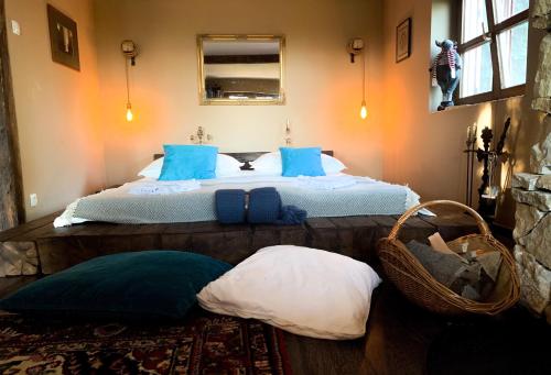 a bedroom with a bed with a cat sitting on it at Hilltop Hideout in Szentendre