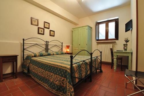 מיטה או מיטות בחדר ב-Agriturismo La Dimora dei Cavalieri