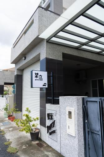 a building with a sign on the side of it at Jerry B&B in Taitung City