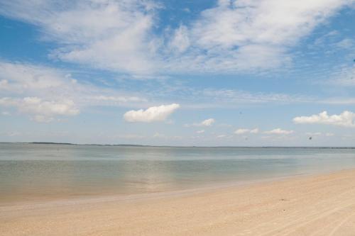 a view of a beach with the sky and water at DeSoto Beach Gardens in Tybee Island