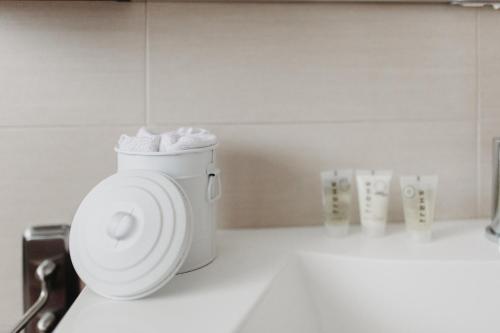 a bathroom with a toilet with towels in it at ROSE GARDEN in Tezze