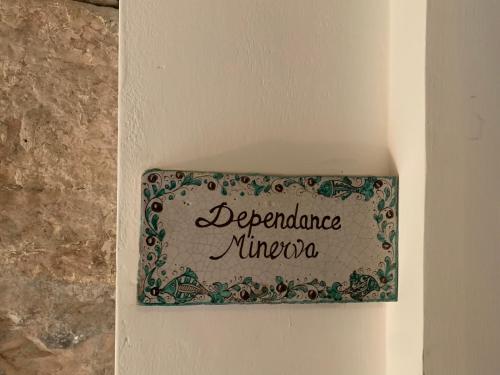 a sign on a wall that reads dependence nitrogen at Apartments Aurora Delle Rose in Assisi