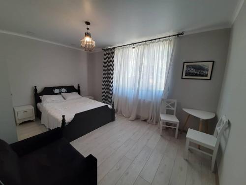 Un ou plusieurs lits dans un hébergement de l'établissement Guesthouse of Manoni Ratiani