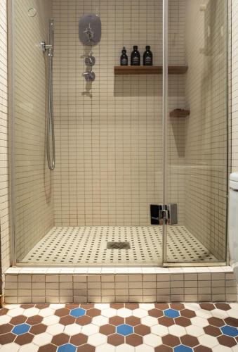 a shower with a glass door in a bathroom at Hotel Blu di Te in Santa Margherita Ligure