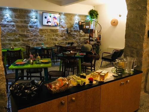 a man sitting at a table in a restaurant at La Vecchia Posta B&B in Calangianus