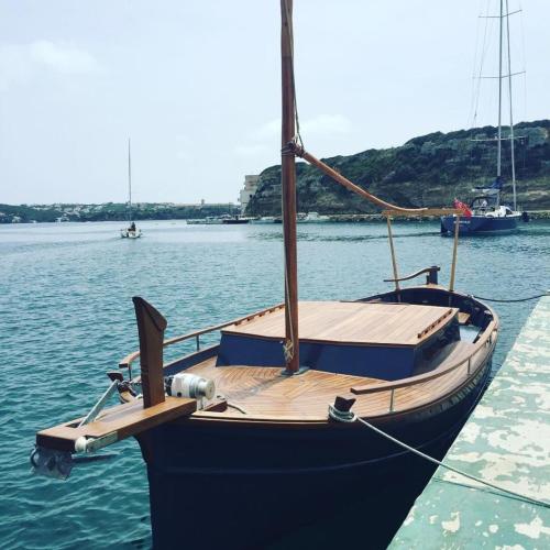 a blue boat tied to a dock in the water at Hotel Blu di Te in Santa Margherita Ligure