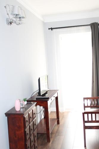 an office with a desk with a laptop on it at Varga Villa in Orfű