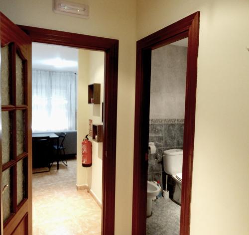 an open door to a room with a bathroom at Apartamento del Rosario in Corella