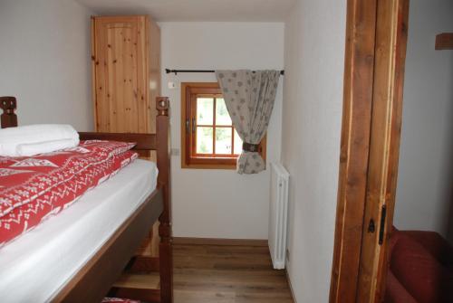 Ένα ή περισσότερα κρεβάτια σε δωμάτιο στο Chalet Stella Alpina