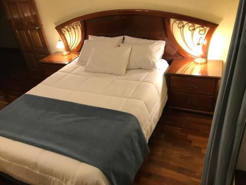 Una cama o camas en una habitación de Hotel Belvedere