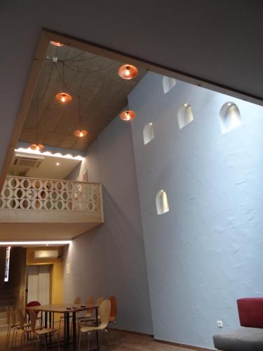 a dining room with a table and chairs at Ura Hostel in Prizren