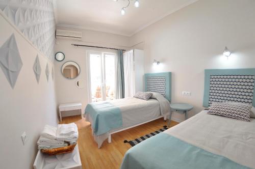 A bed or beds in a room at Tango Apartment On The Beach