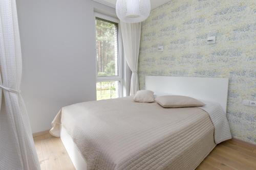 Llit o llits en una habitació de AMI Vanagupės forest
