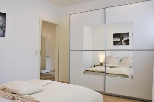 a bedroom with a large glass wall at Ferienwohnung in Zweibrücken