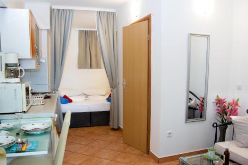 a small apartment with a small room with a bed at Apartments Ankica in Šibenik