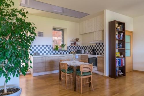 a kitchen with a table and chairs in a room at Eco Villa in Mákri