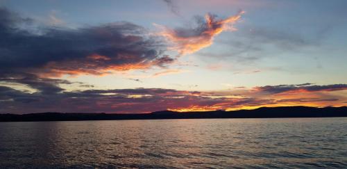 a sunset over a large body of water at Aspra al delfino blu in Bagheria