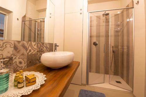 a bathroom with a sink and a shower at Casa Vacanze Gombito 4 Bergamo Alta in Bergamo