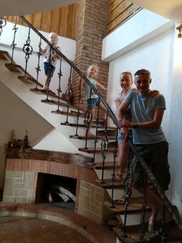a group of children on the stairs of a house at Golden Gate in Akhaltsikhe